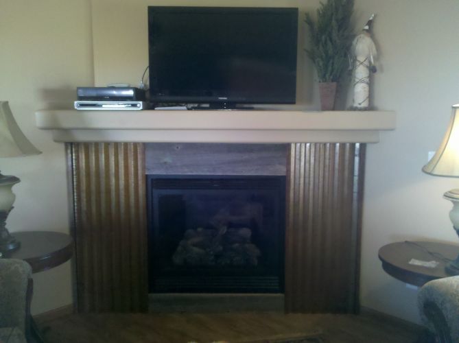 Built-In Gas Fireplace With Tin Surround